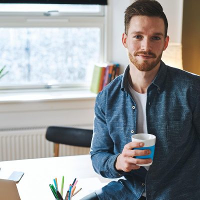 young-entrepreneur-sitting-in-his-office-F7Y2RBG.jpg